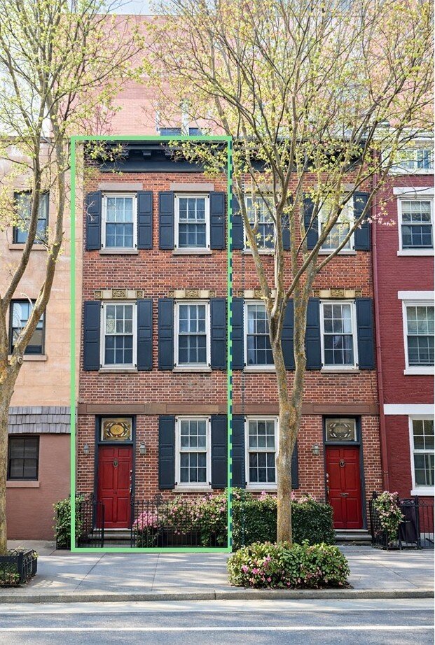 Front facade with two red doors